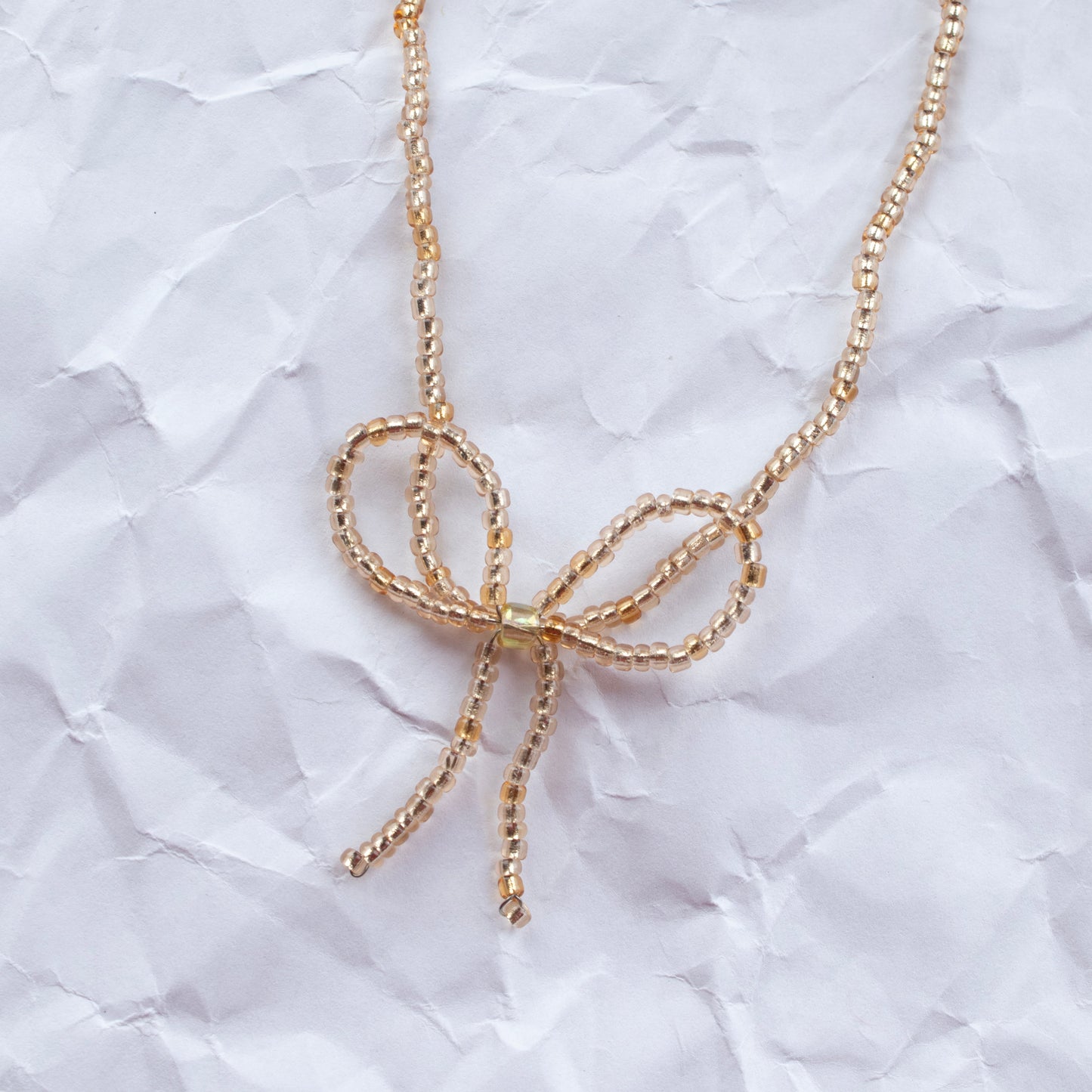 BOW BEADS KETTING GOUD