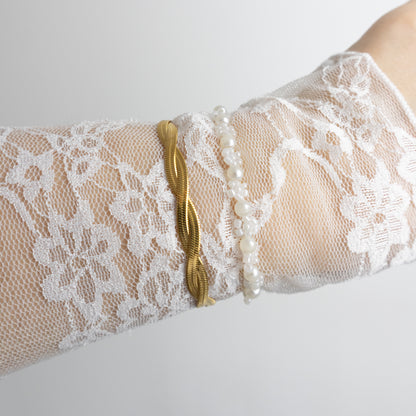 FLAT TWISTED ARMBAND - GOUD